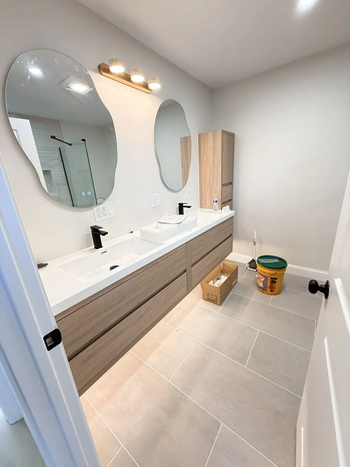 Floating wood double vanity & organic mirrors